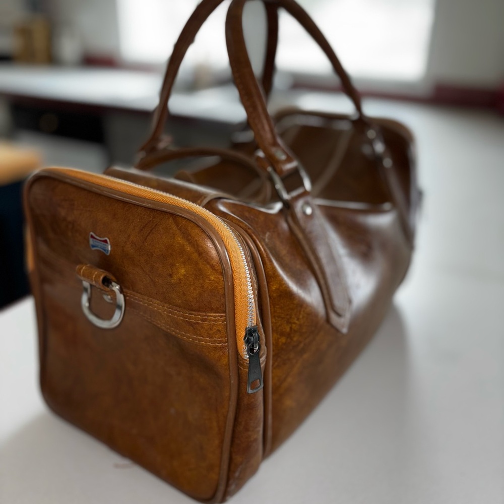 American Tourister Brown Travel Bag with Polished Finish
